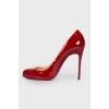 Red patent heel pumps