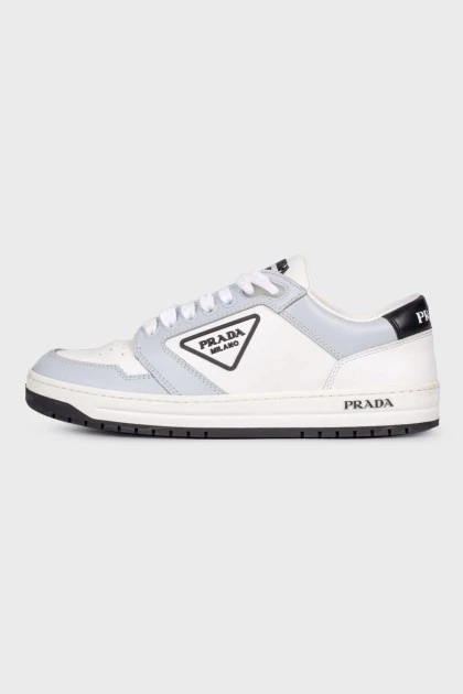 White and blue sneakers with logo