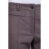 Gray trousers with zippers on pockets