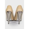 Beige shoes with silver heels