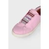 Pink sneakers with textile logo