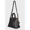 Black leather bag with lock