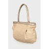 Wicker bag with leather handles
