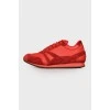 Red sneakers with suede inserts