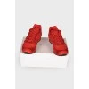 Red sneakers with suede inserts