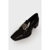 Black loafers with brand logo