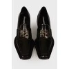 Black loafers with brand logo