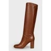 Brown heeled knee high boots