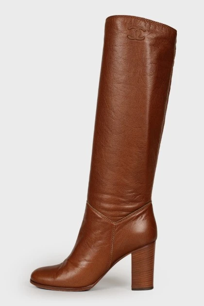 Brown heeled knee high boots
