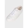 White sneakers with brand logo