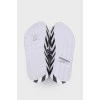 Black and white flip flops with tag
