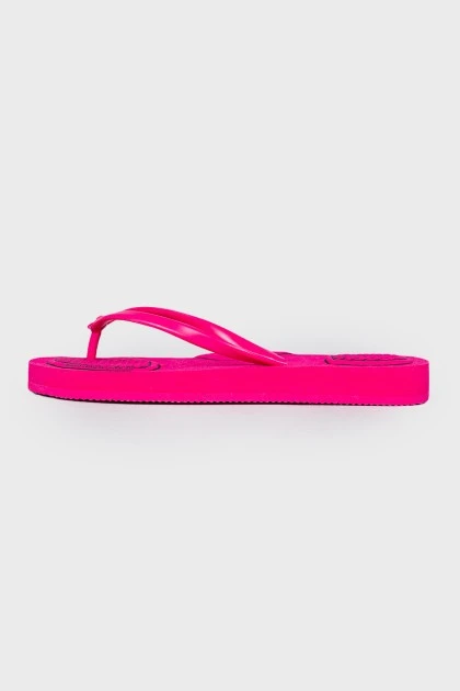 Pink flip flops with tag