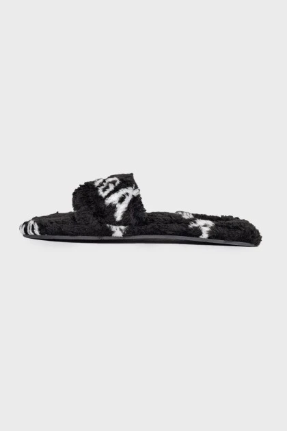 Black fur slippers with tag