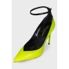 Green heeled shoes with tag
