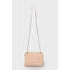 Beige bag with a thin chain strap