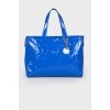Lacquered blue bag with a metal keyring
