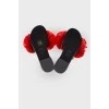 Slippers with red pom-poms