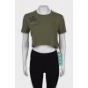 Green crop top with tag