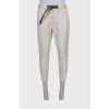 Men's light gray trousers with a belt