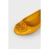 Yellow ballet flats with brand logo