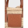Straw bag with leather handles