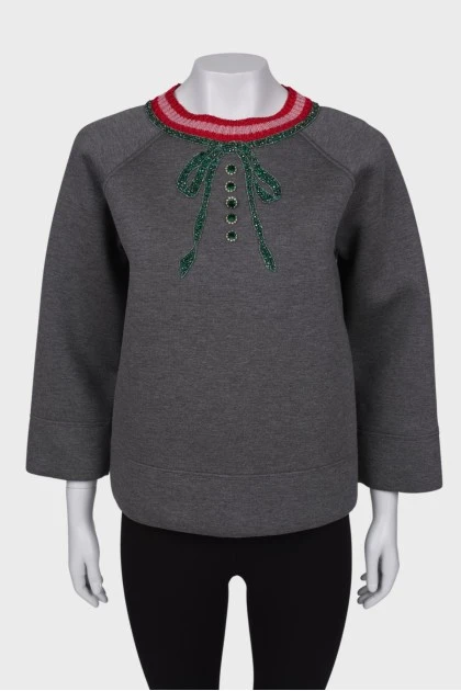 Gray sweatshirt with a decorated collar