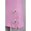 Pink skirt with flower brooches