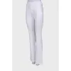 White flared trousers with tag