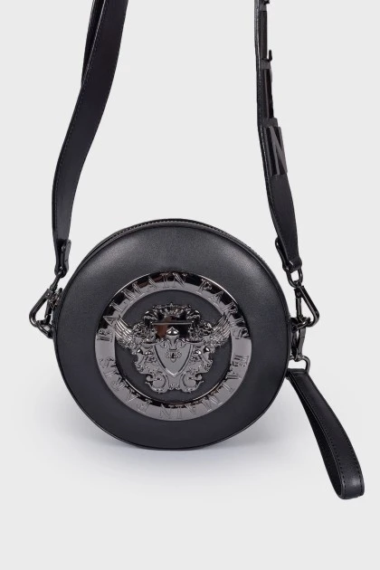 Round bag with metal decoration