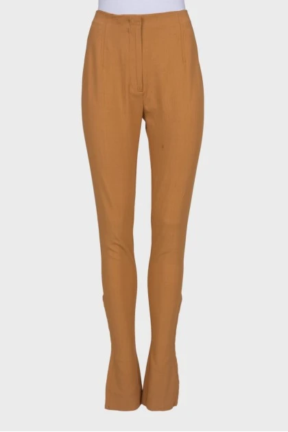 Mustard trousers with hooks at the bottom
