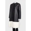 Leather coat with white fur on the hem