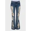 Flare jeans with distressed effect