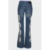 Flare jeans with distressed effect