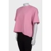 Pink T-shirt with shoulder pads and tag