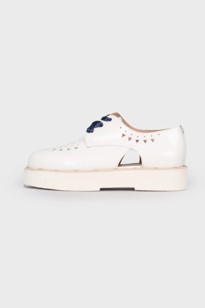 White lace-up loafers