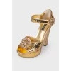 Golden sandals with rhinestones