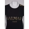 Black T-shirt with golden lettering