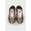Sneakers with gold sequins