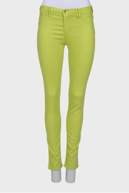 Light green jeans with a tag