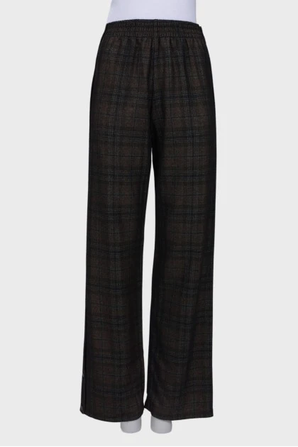Wool trousers with press-studs on the sides
