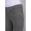 Gray jeans with a zipper at the bottom