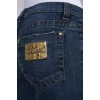 Jeans with a gold patch on the pocket