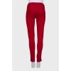Red jeans with zipper pockets