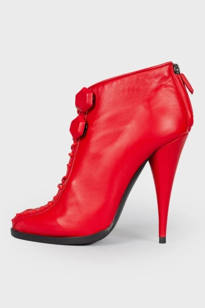 Red lace-up ankle boots