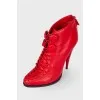 Red lace-up ankle boots