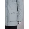 Light gray parka with fur on the hood with a tag