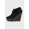 Black high wedge ankle boots