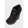 Black high wedge ankle boots