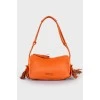 Orange leather tassel bag