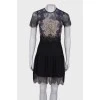 Lace dress with ruffles at the bottom
